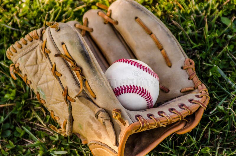 baseball game mitt ball old worn glove old grass field 47466785