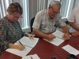 Firman historiadores y educadores convenio de trabajo